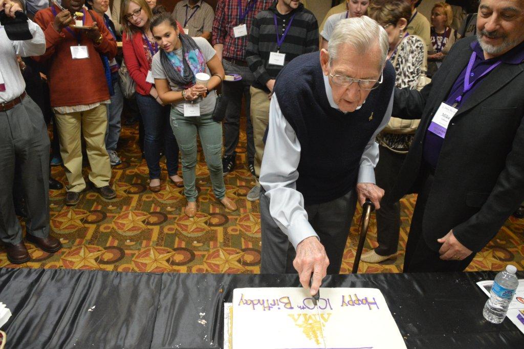 Tony Jablonski --who has served DMD for half of its life--cuts the birthday cake.jpg.